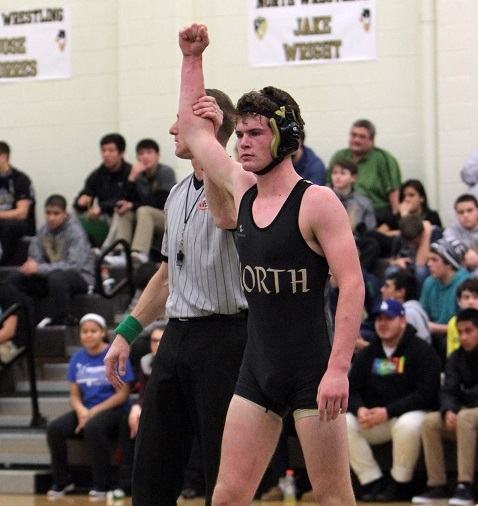 Senior wrestler Jake Wright  gets his hand raised after his senior night match.