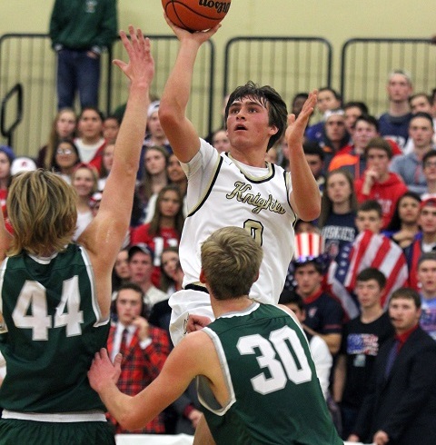 Senior Bobby Krebs goes up in traffic in a home game against  rival Grayslake Central.