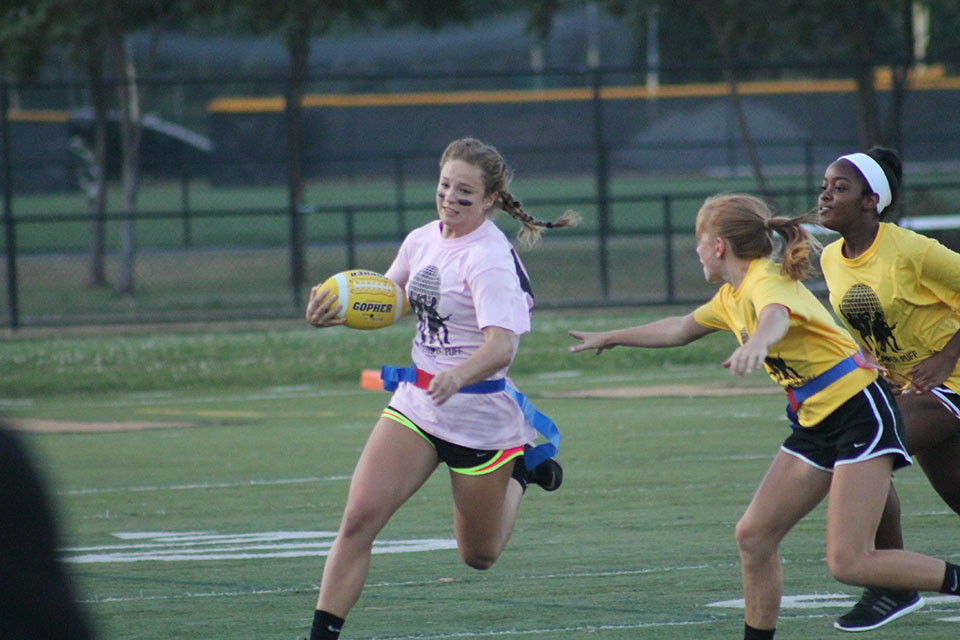 Students participate in Powder Puff game during Homecoming Week