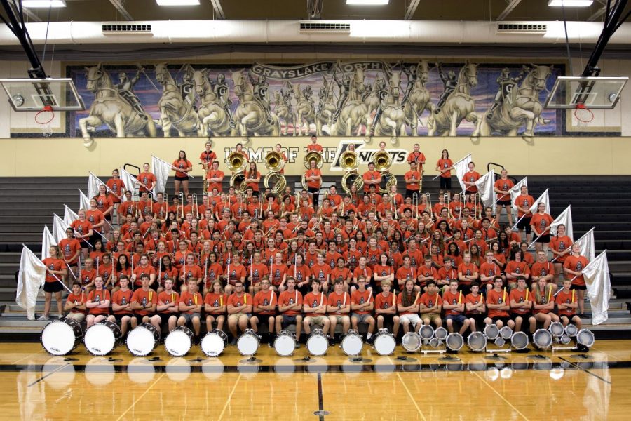 This years marching band and color guard teams pose for a group picture.