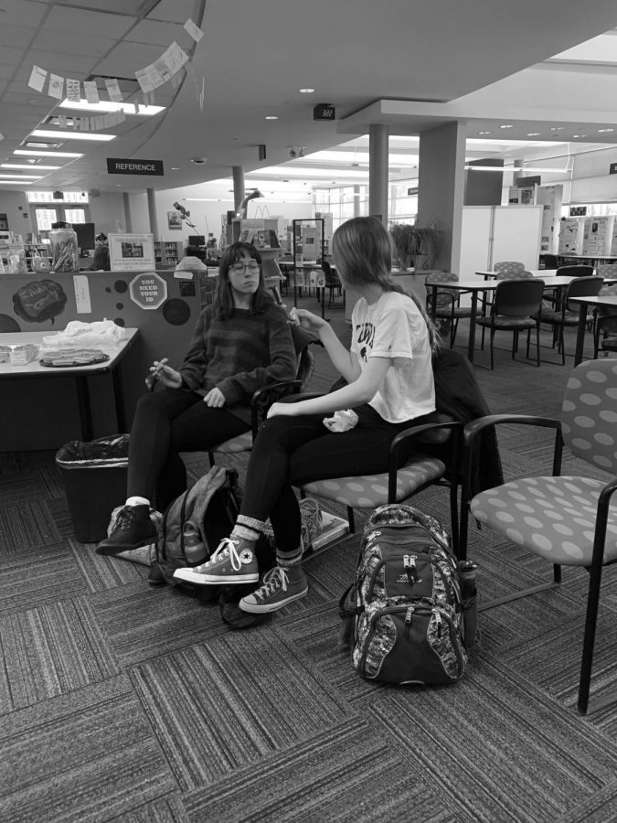 Seniors Amelia Shingle (left) and Ciara White (right) discuss issues that marginalized people face.