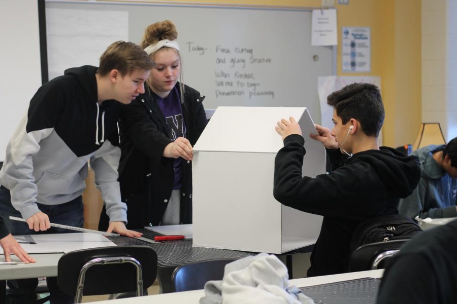 Sophomores+Braden+Tyler+and+Kameron+Herron+work+on+building+their+mini+library.%0APhoto+By%3A+Shalynn+Billings