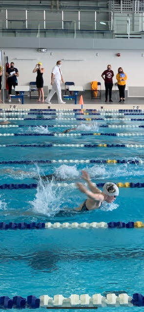 Junior Cassia Campbell swims for North at the Sectional competition.