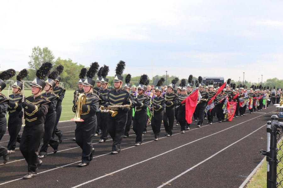 The Marching Band marched off the field after a successful first performance.