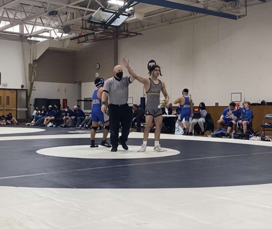 The wrestlers competed at a quad meet at Cary Grove High School on December 4, 2021.
