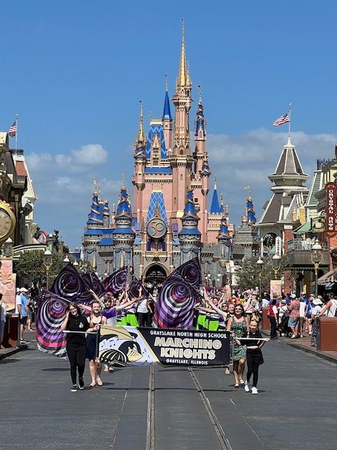 The+marching+band+performed+in+a+parade+in+the+Magic+Kingdom.