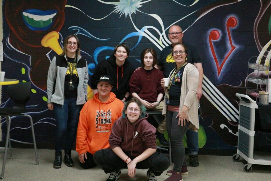 Members of NAHS, Chase Rubert and Liam Tuzik pose in front of mural with President Mikayla Rieber, Vice President Luke Rathunde, and teachers Randall Sweitzer, Meghan Crowley and Kelly Bott.